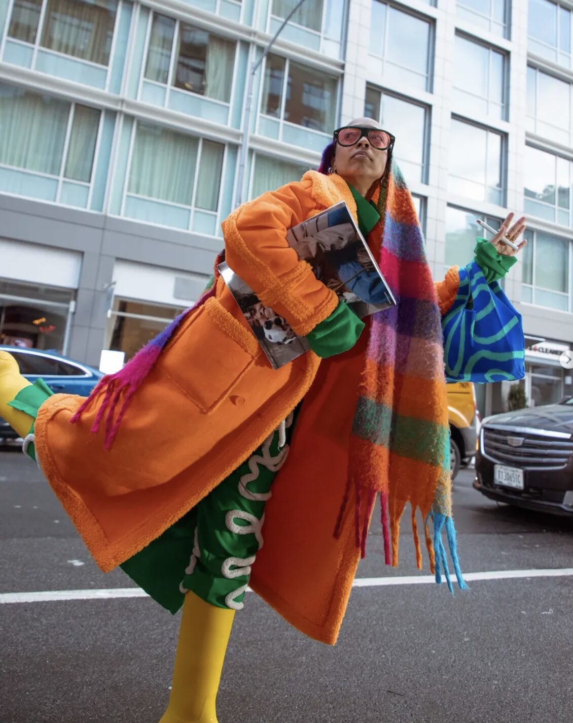 Jade Lilly on the street in color, arms open